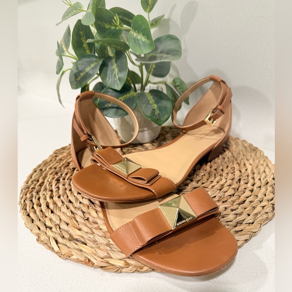 Michael Kors Aliza Flat Leather Sandals in acorn brown.